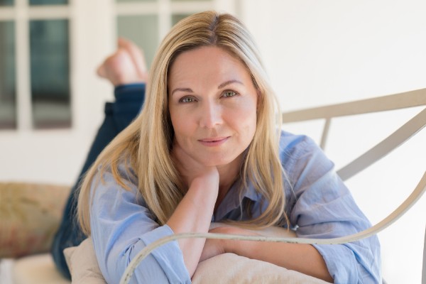 Homeowner relaxing in her freshly cleaned home